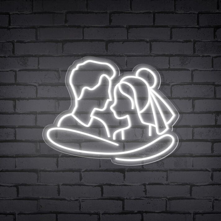 Add a Romantic Glow to Your Bedroom, Wedding, or Anniversary Celebration with the Cuddling Couple Shape Neon Sign.