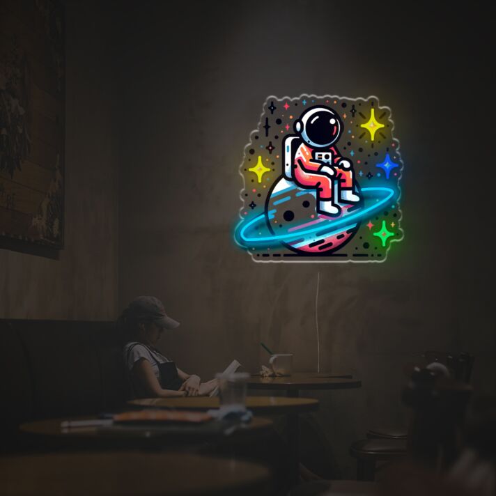 Elevate your space with Astronaut Sitting On The Planet LED Neon Acrylic Artwork – Perfect for home decor, trendy office settings, and sci-fi themed bars.