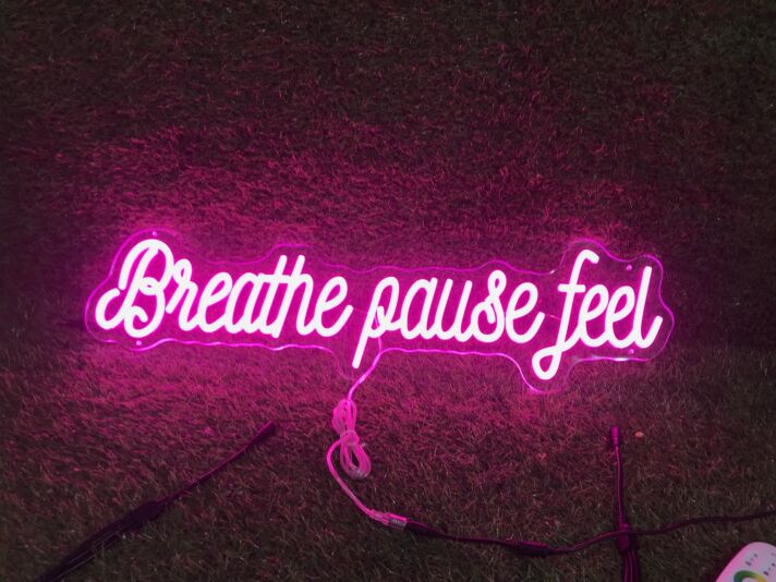 Brighten Up Your Space: Breathe Pause Feel Pink LED Neon Sign Perfect for Home Decor, Relaxing Office Environments, and Trendy Bar Settings.