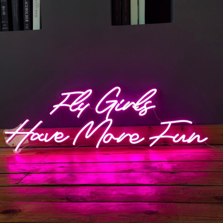'Fly girls have more fun' neon sign
