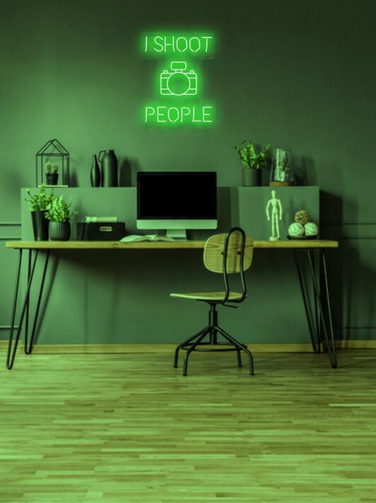 I shoot people Photographer's Neon Tribute to Capturing Moments