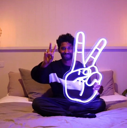 Peace hand symbol neon sign