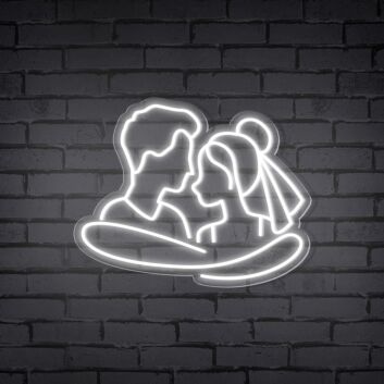 Add a Romantic Glow to Your Bedroom, Wedding, or Anniversary Celebration with the Cuddling Couple Shape Neon Sign.