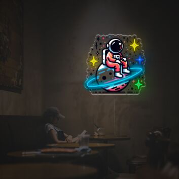 Elevate your space with Astronaut Sitting On The Planet LED Neon Acrylic Artwork – Perfect for home decor, trendy office settings, and sci-fi themed bars.