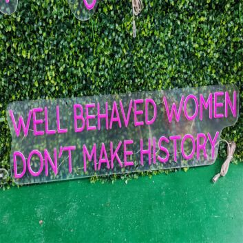 Brighten Your Bar, Office, or Feminist Gathering with the Well Behaved Women Dont Make History Purple LED Neon Sign.