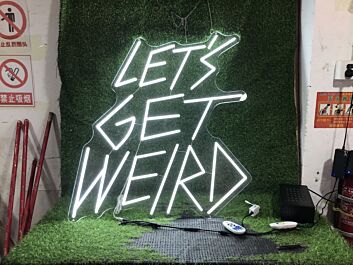 Brighten Your Office, Bar, or Next Event with the Lets Get Weird White LED Neon Sign.