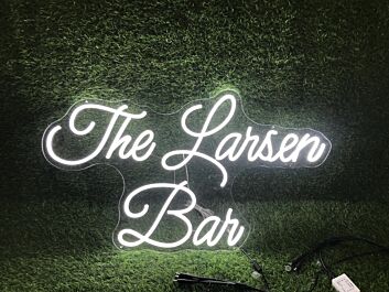 Brighten Up Your Bar, Office, or Wedding with The Larsen Ban White LED Neon Sign.
