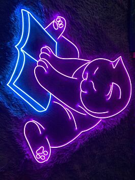 Brighten Your Reading Nook and Library with the Cozy Glow of the Cat Book LED Sign - Perfect for Animal Lovers and Decor Enthusiasts Alike.