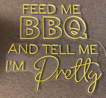 Brighten Up Your Kitchen or Backyard Bash with the &quot;Feed Me BBQ and Tell Me I&#039;m Pretty&quot; LED Neon Sign