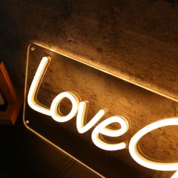 Love Grows Yellow Neon Sign