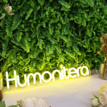 Humanitera Yellow Neon Sign