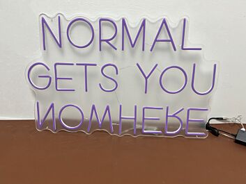 &#39;Normal gets you nowhere&#39; neon sign