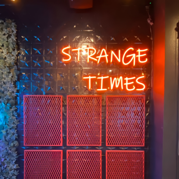 Strange Times: Illuminate Your Space with an Eccentric Vibe - Neon Sign