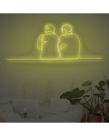 Couple Sitting Together Neon Sign