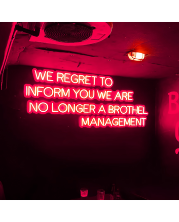 We Regret to Inform You We Are No Longer a Brothel Management Neon Sign: Changing Times in Neon