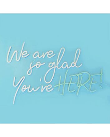 We Are So Glad Youre Here Neon Sign creates a welcoming atmosphere