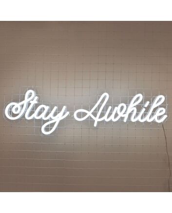 Stay Awhile Neon Sign perfect for cozy living room settings
