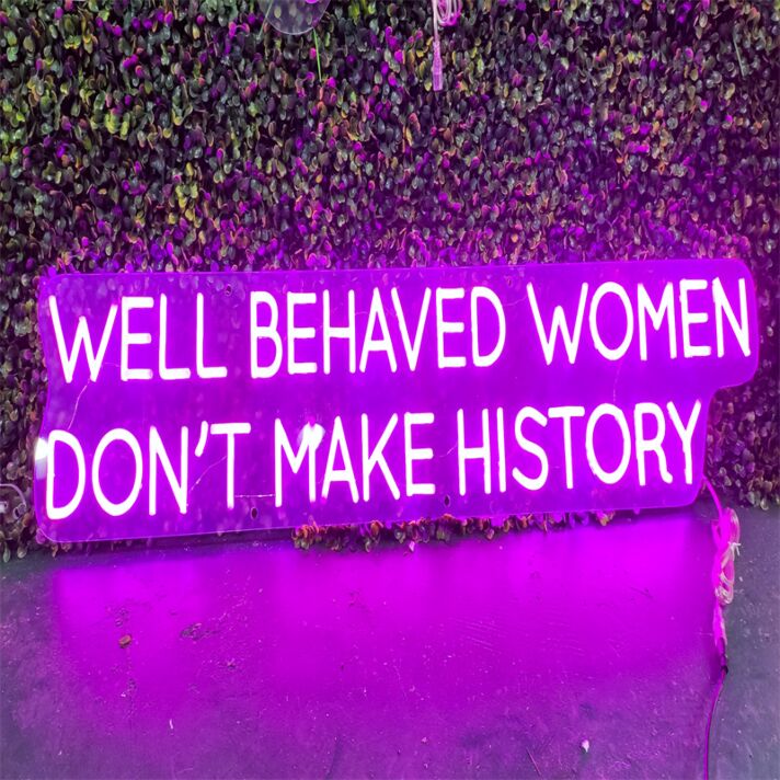 Brighten Your Bar, Office, or Feminist Gathering with the Well Behaved Women Dont Make History Purple LED Neon Sign.