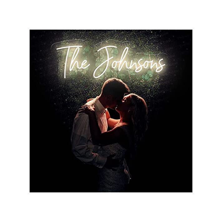 The Johnsons Neon Name Signs Warm White Neon Sign Hung On Grass Wall